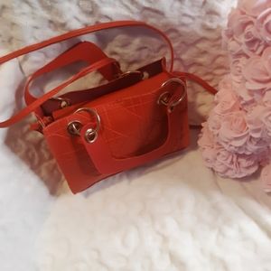 A cute small red crossbag
